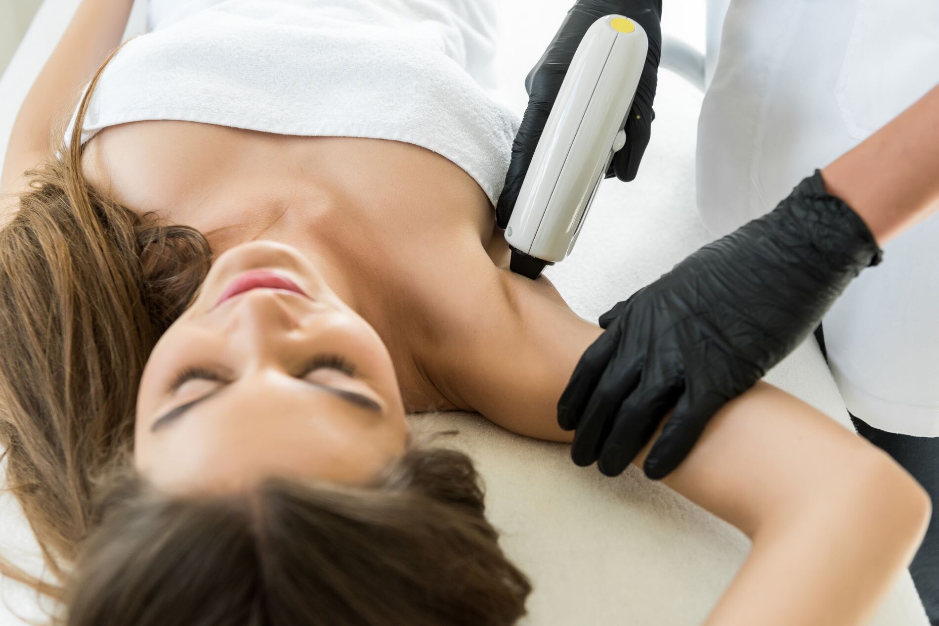 A woman getting a hair removal treatment at Limelight Medical Spa in Cincinnati.