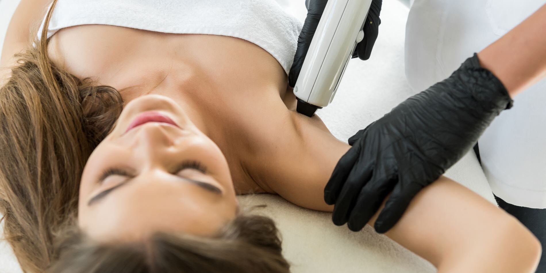 A woman getting a hair removal treatment at Limelight Medical Spa in Cincinnati.