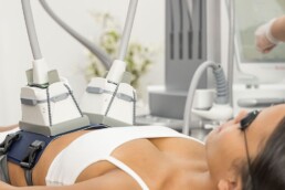 A woman is receiving wellness services at a laser center in Cincinnati.