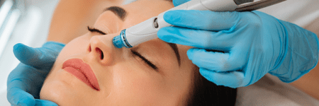 A woman receiving a facial treatment at a Health Spa in Cincinnati.