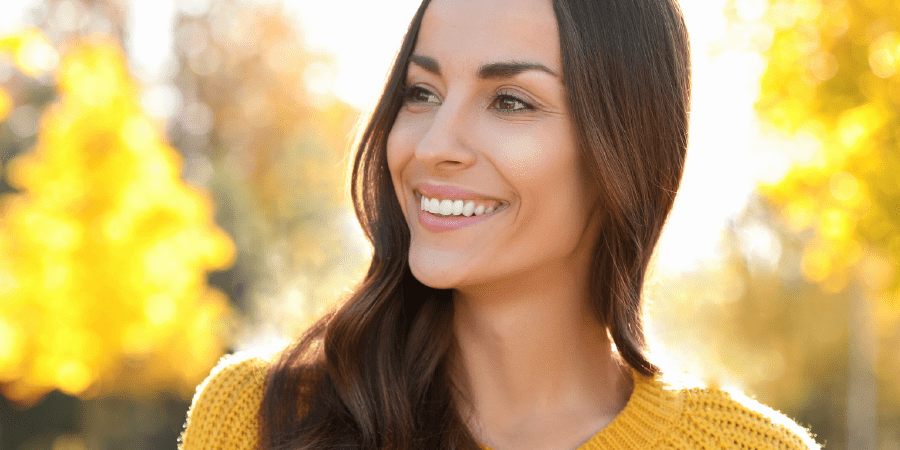 model smiling showing beautiful medical spa results